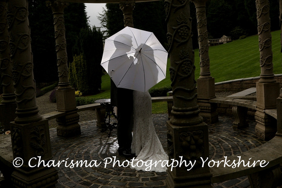 Bride & Groom outside wedding umbrella silhouette